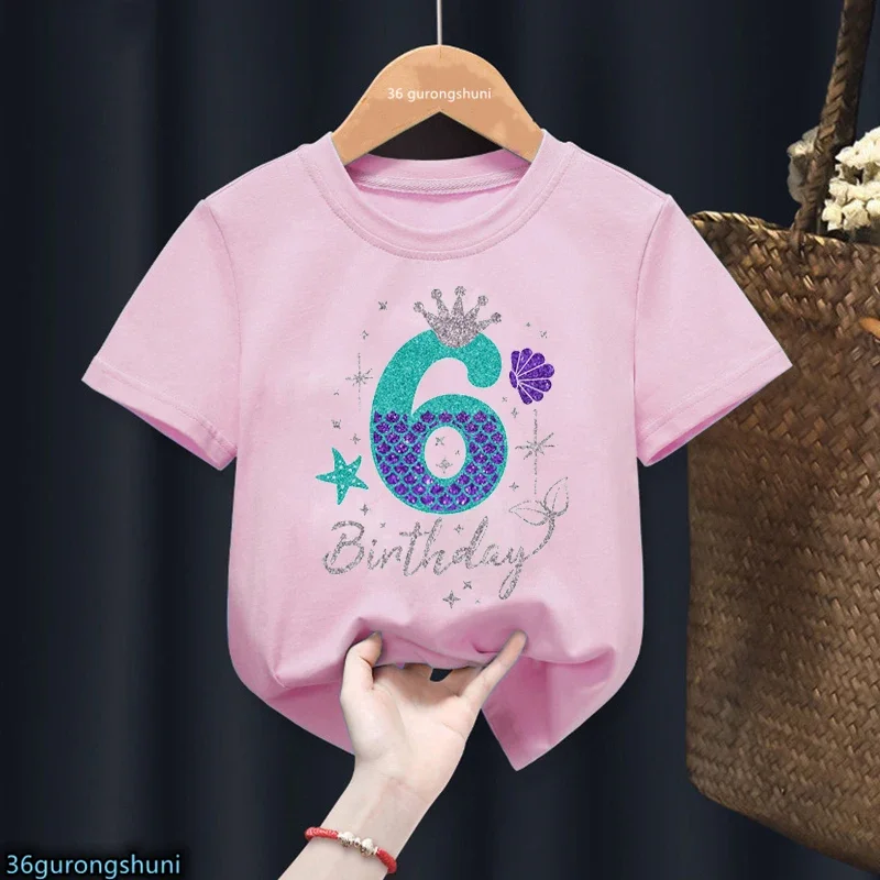 thumbnail image 1 of Bonita ropa para niños, regalo de sexto cumpleaños, camiseta de algodón para niñas, camiseta con estampado de corona de princesa sirena, camisetas rosas Harajuku Kawaii, 1 of 5