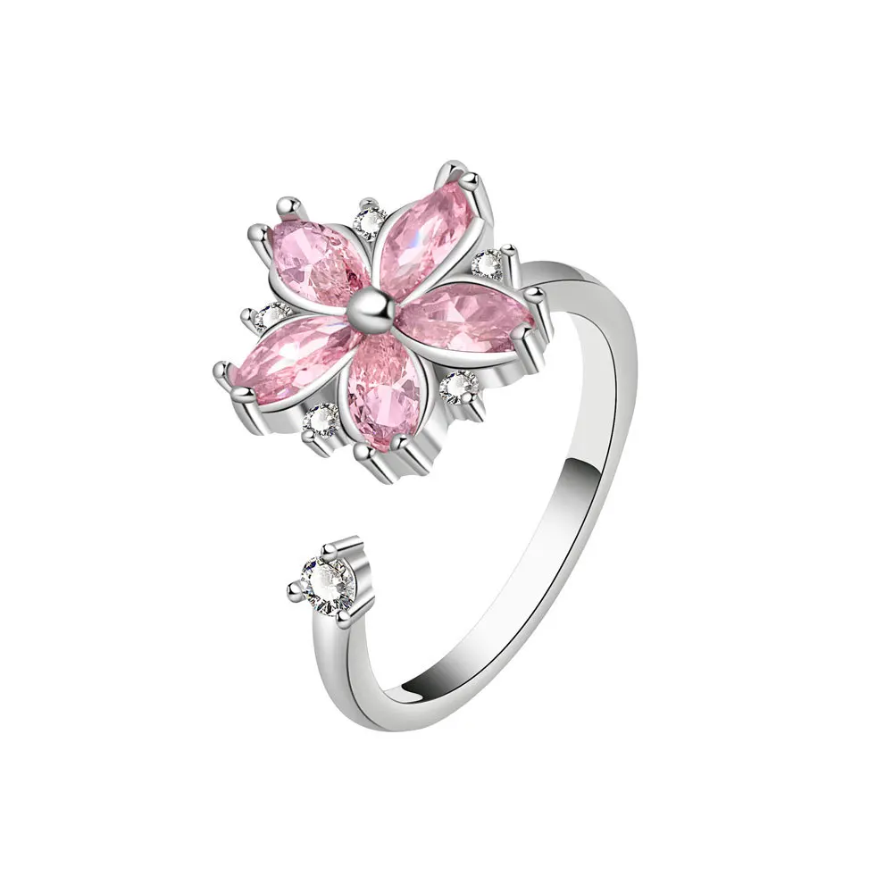 Anillo femenino rosado con zirconia y diseño floral