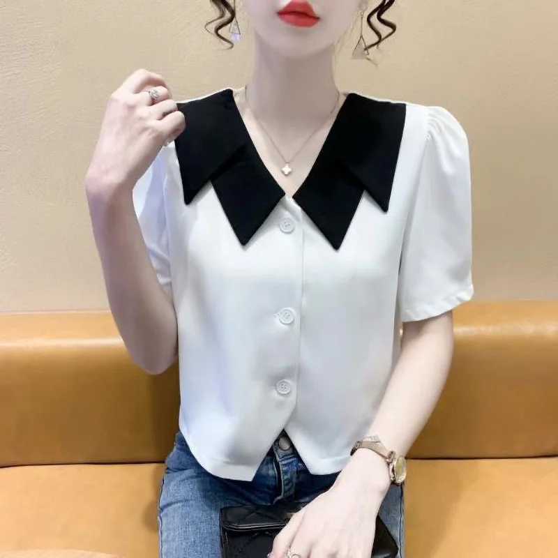 Elegant Peter Pan Collar Button Spliced Asymmetrica Shirt Female Clothing 2024 Summer New Short Sleeve Commute Tops Sweet Blouse
