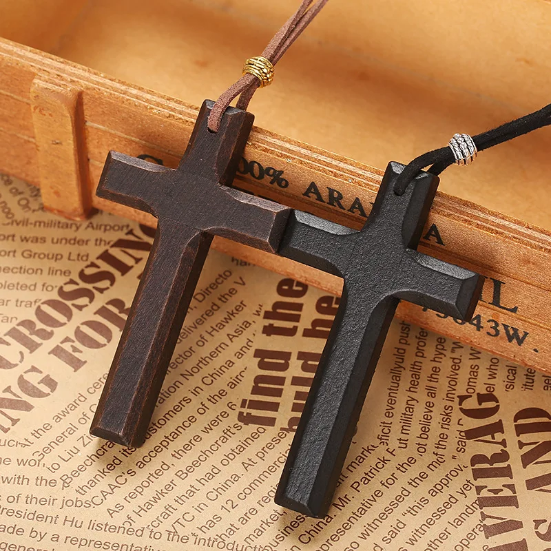 Wooden cross pendant necklace in black and brown, displayed on cords, suitable for men and women.