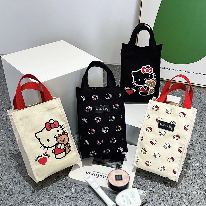 

MINISO Commuters Handbags Canvas Bags Y2K Kawaii Water Cup Bag Cute Anime Hello Kitty Tote Bucket Shaped Portable Bento Bag Gift