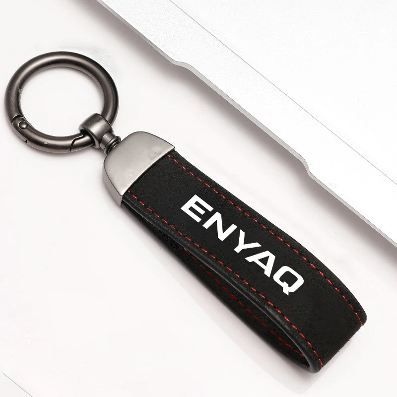 Elegant Metal and Suede Car Keychain with Emblem Design