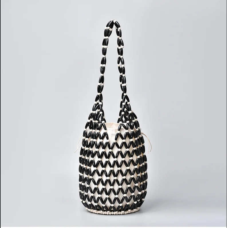 Borsa a spalla donna intrecciata con perline in legno borsa a secchiello_voghion.com