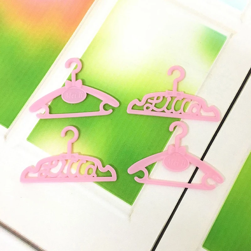 

10 Pcs/Lot Hangers Dress Clothes Accessories For Doll Pretend Play New year Girls' Gift Wholesale