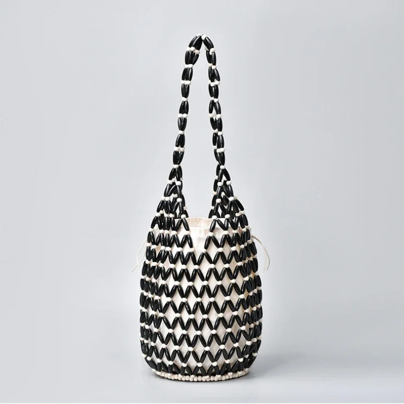 Borsa in tessuto scavato stile Boho estivo per donna Borsa a tracolla con perline di legno moda Borse a secchiello in rete per vacanze al mare Bolsa