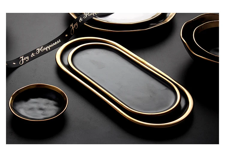 Matte black ceramic plates with gold accents