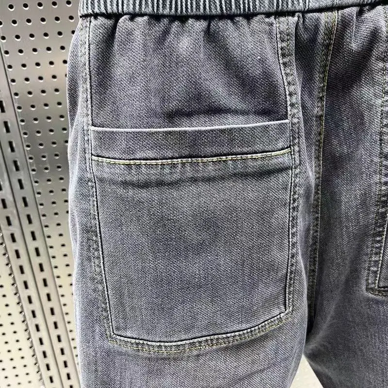 New Arrival Korean Style Fashion Stretch Denim Jeans for Men Elastic Waistband Drawstring Design Harem Jeans Cotton Trousers