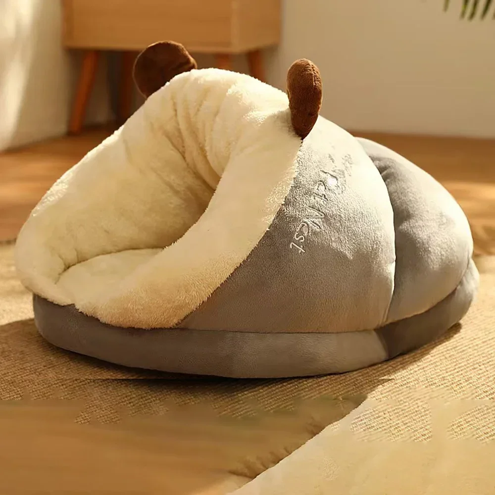 A slate grey, cave-style Warm Pet Bed with a soft white faux-fur lining and small brown plush ears attached to the roof.