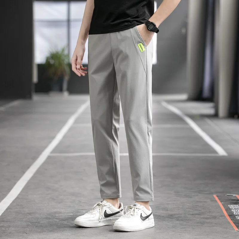 Men's Spring Autumn Elastic Casual High Waist Solid Pockets Letter Patch Casual Harlan Feet Trousers Cargo Office Lady Pants
