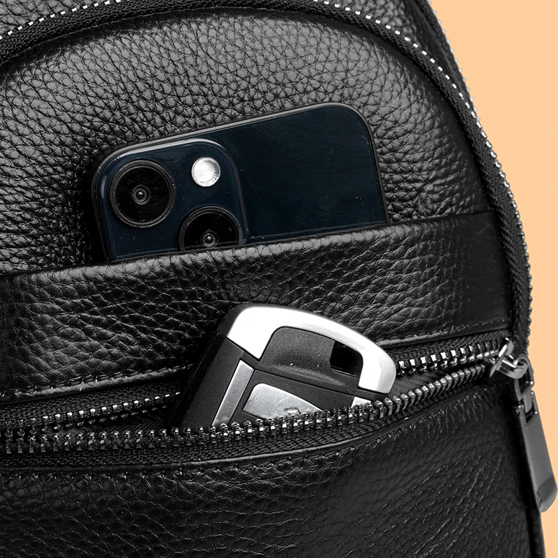 Stylish genuine leather sling bag for men with multiple compartments, ideal for everyday carry or travel