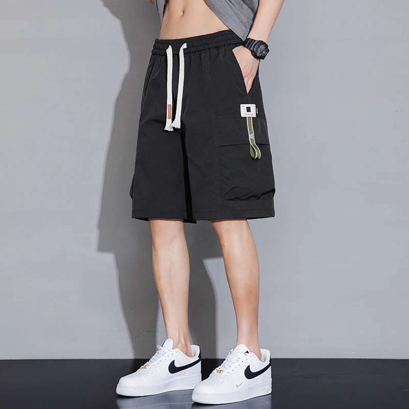Fashion Elastic Lace Up Spliced Pockets Casual Shorts Men's Clothing 2024 Summer New Loose Korean Solid Color Knee Cargo Shorts