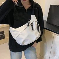 Neutral style tote bag with strap for carrying fitness items. New mini street-style handbag with shoulder strap. Lightweight and 5