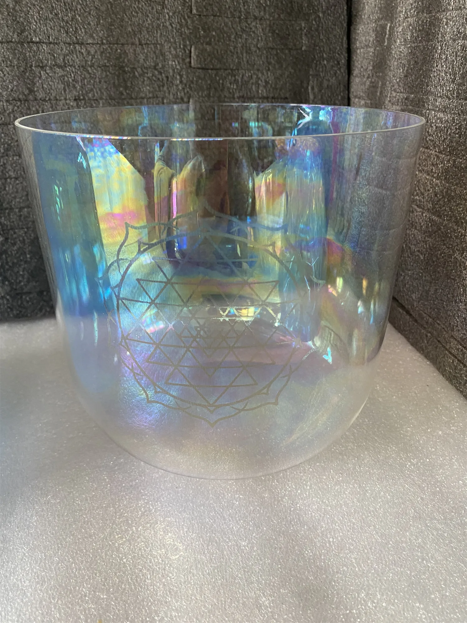 Heart chakra Crystal singing bowl 3rd octave F note clear cosmic color with "shri yantra" engraving for sound healing.