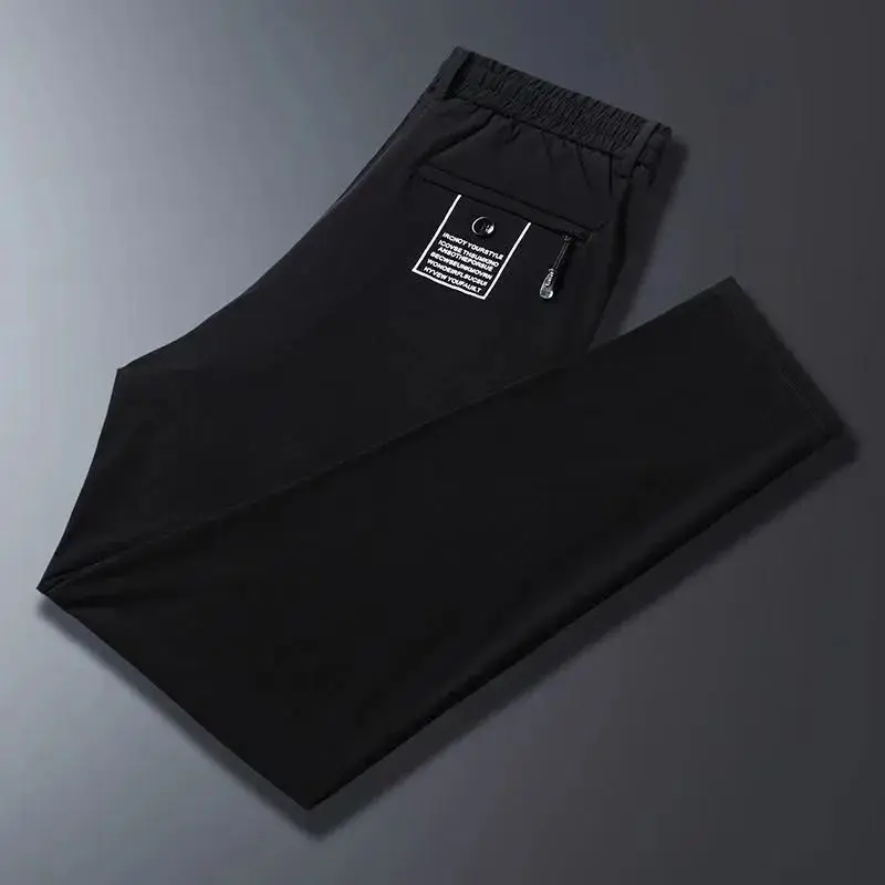 2024 New Summer Men's Ice Shreds Thin Style Trousers Solid Color Elastic Button Zipper Fashionable Loose Casual Harlan Pants