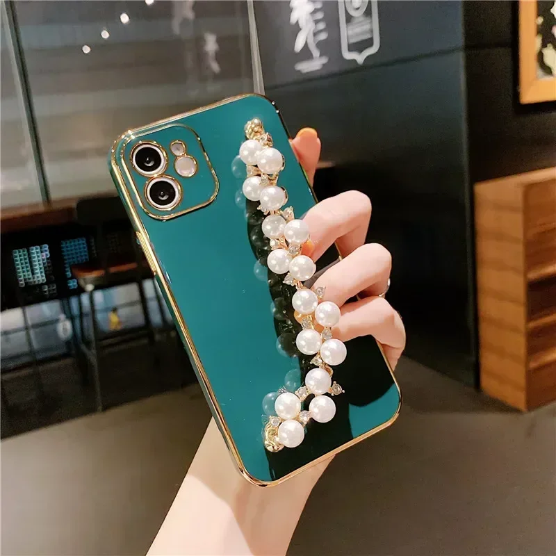 thumbnail image 1 of Funda blanda con cadena y pulsera de perlas chapadas de lujo para iPhone 15, 13, 14, 12 Pro Max, 11, XS, X, XR, 7, 8 Plus, mini SE, funda de silicona con purpurina, 1 of 5