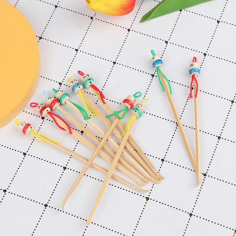 Description Picture 6 of item10Pcs Mini Doll Earpicks Wood Bamboo Ear Picks Wax Remover Cleaner Ear Care Tool