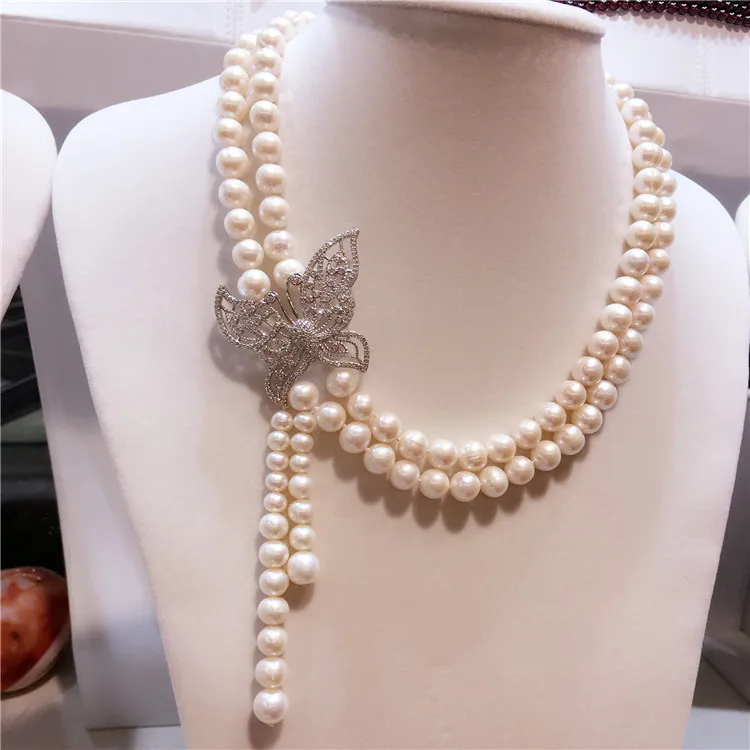 

Hand knotted 8-9mm white natural freshwater pearl bow micro inlay zircon clasp tassel necklace fashion jewelry