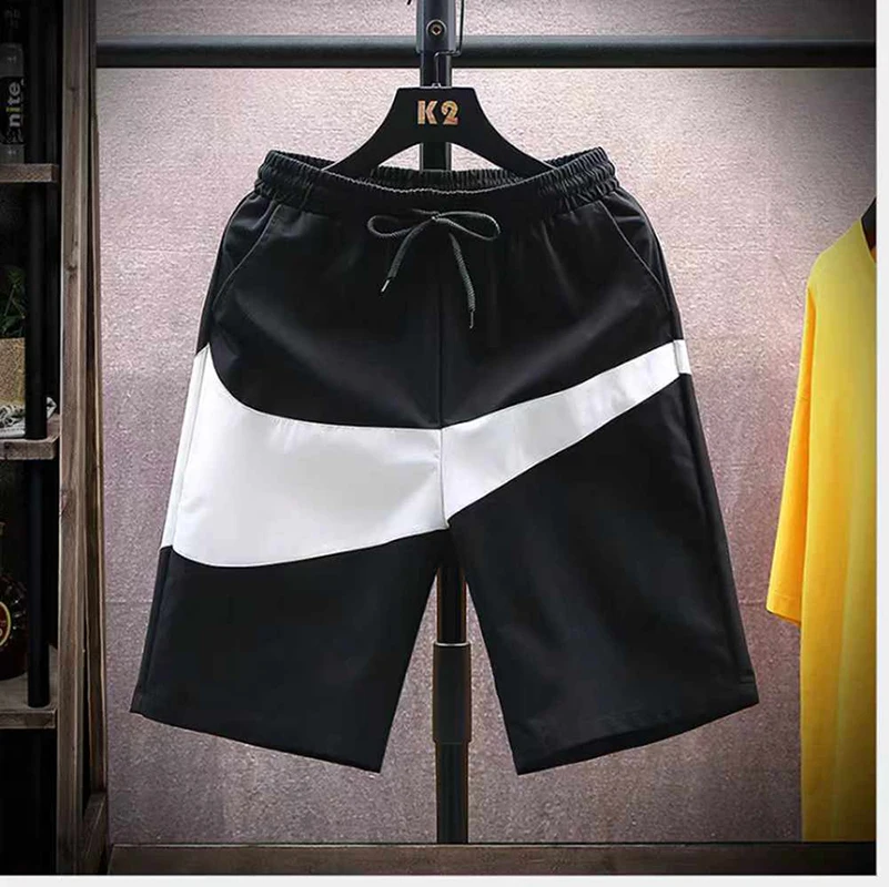 

Shorts men's summer trend color blocked loose and versatile casual mid length pants men's sports quick drying beach five quarter