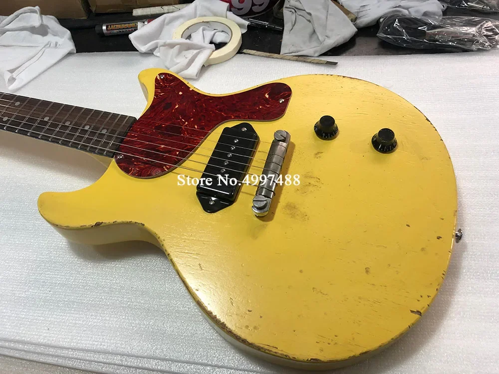 

1959 Junior TV Yellow Relic Electric Guitar,Black P90 Dog Ear Singlecoil Pickup,Red Turtle Shell Pickguard,Wrap Around Tailpiece