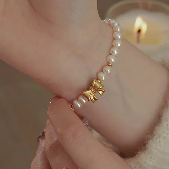 

Light luxury S925 sterling silver gilt bowknot natural oval freshwater pearl bracelet for women