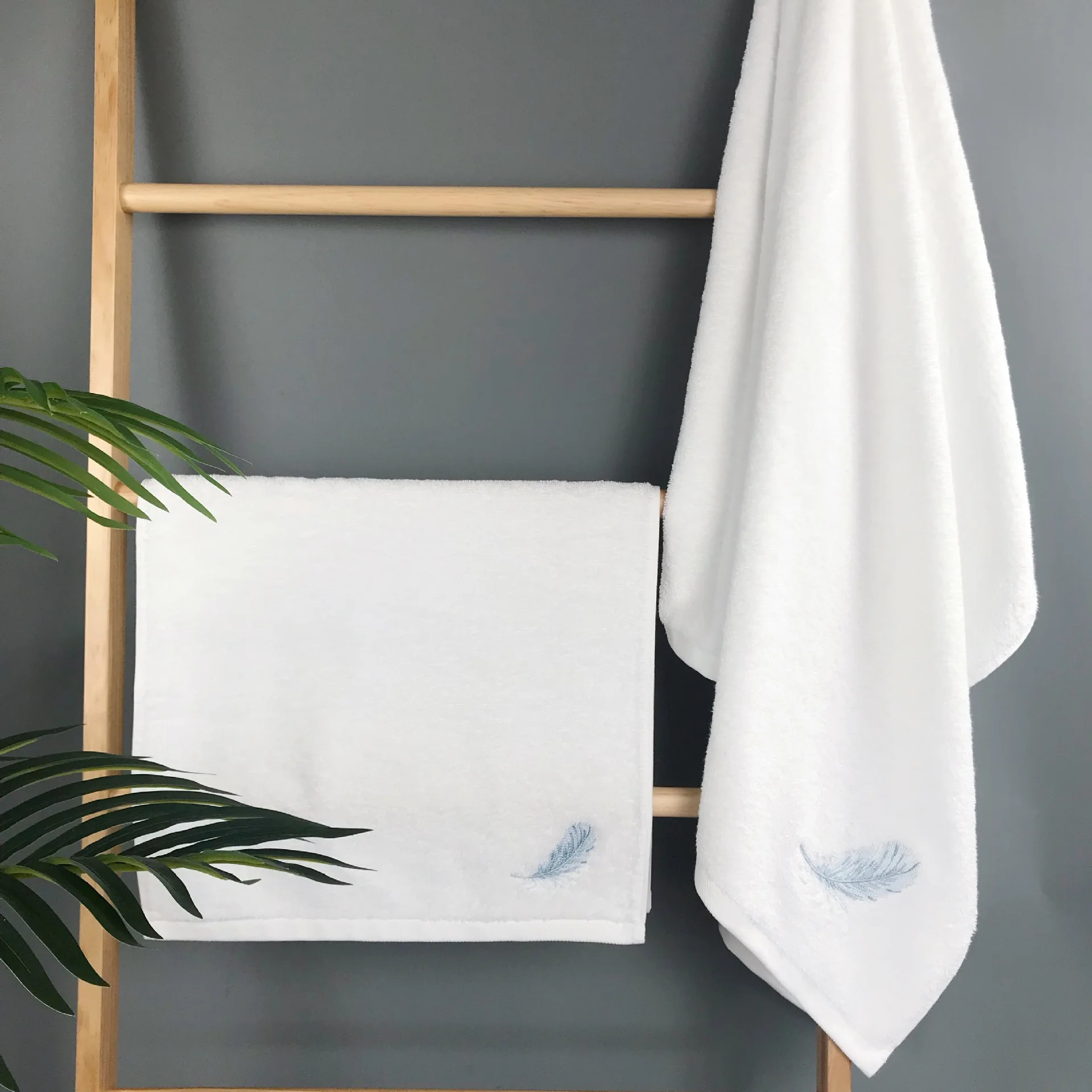 https://ae01.alicdn.com/kf/S7fc357c8d3da456aa492c35d92c7b7e99/Feather-Embroidered-Cotton-Towel-Solid-Color-Soft-Absorbent-Men-s-and-Women-s-Household-Towel-Bath.jpg