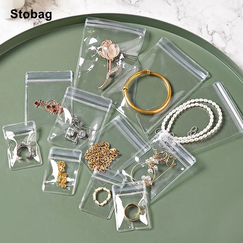 https://ae01.alicdn.com/kf/S7fc8036ed3e74fa99a2d6ddc9c3029e2G/StoBag-100pcs-Plastic-Jewelry-Packaging-Ziplock-Bag-Transparent-Small-Waterproof-Sealed-Thick-Pouch-Earrings-Bracelets-Organizer.jpg