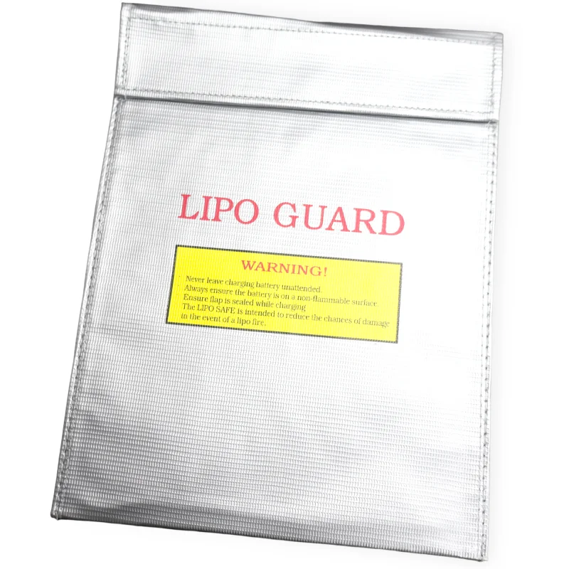 Sac de sécurité ignifuge pour batterie LiPo posé sur une surface plane, avec anse de transport visible, idéal pour la protection anti-explosion.