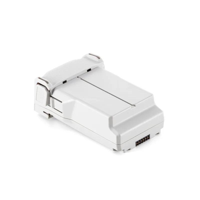 Batterie drone DJI Mini 3/Pro insérée dans le compartiment du drone, prête à l'emploi.