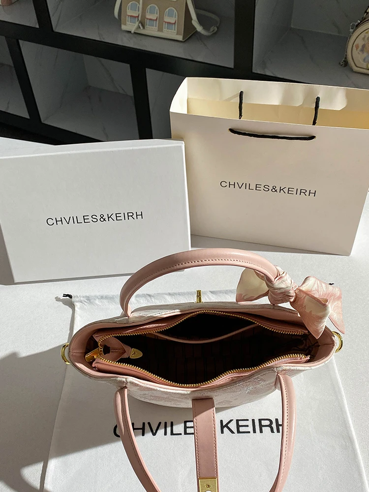 حقيبة حمل جلدية محمولة للنساء، تتميز بطباعة زهور ر...