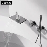 Minimalistisk veggmontert badekarkran i gunmetal med fossefallutløp