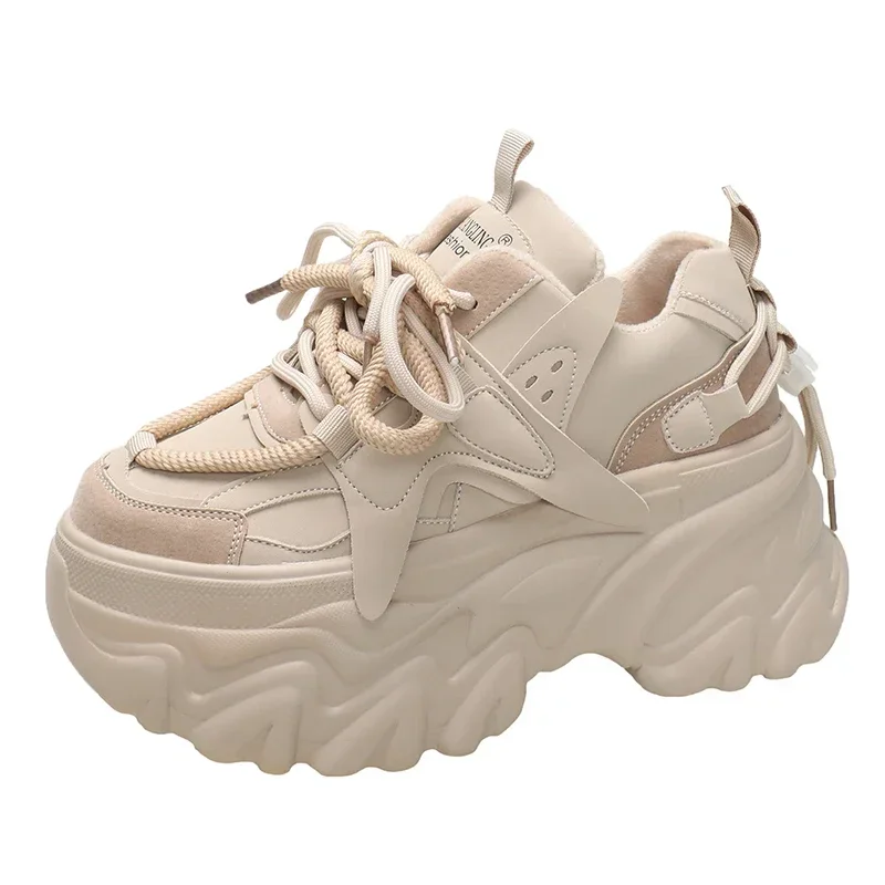 

Женские кожаные кроссовки на танкетке 10 см