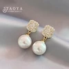 Boucles d'oreilles pendantes en perles de cristal pour femmes, accessoires d'oreille exquis, bijoux de fête, document en or, brillant, luxe, mode 2025