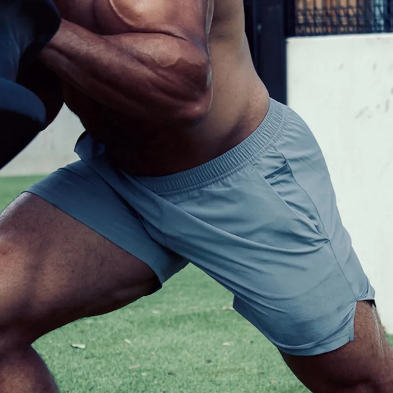 Muscle fitness brother sports shorts men's summer woven running equipment training elastic quick-drying beach three-point pants