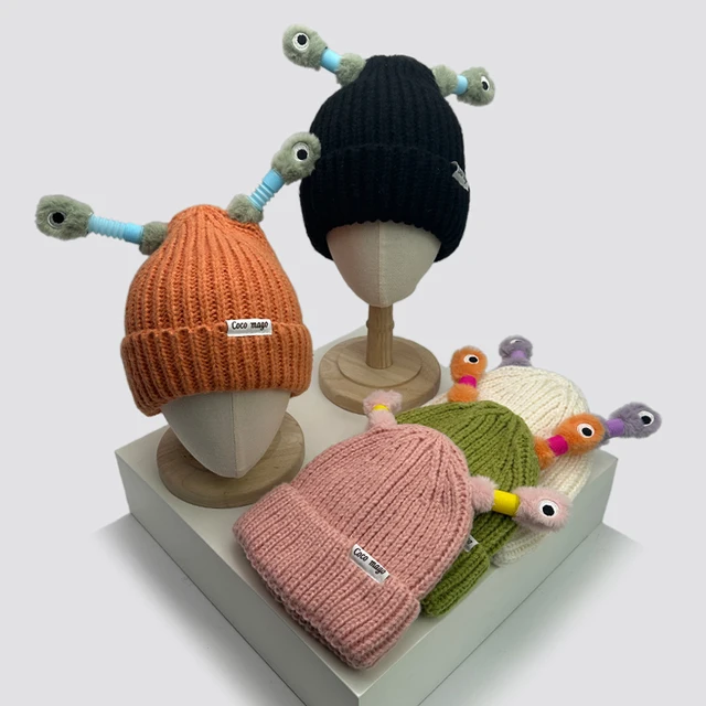 Stay warm and stylish with the Autumn and Winter New Funny Cartoon Glowing Little Monster Bucket Knitted Hats.