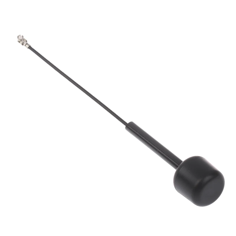 Antenne omnidirectionnelle Walksnail Avatar VTX V2 5.8GHz LHCP posée sur une surface noire, avec reflets métalliques.