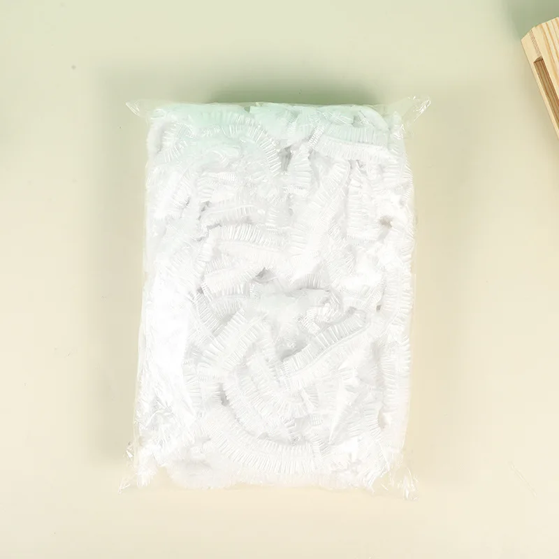 100 قطعة غطاء دش بلاستيكي للاستعمال مرة واحدة قبعا...