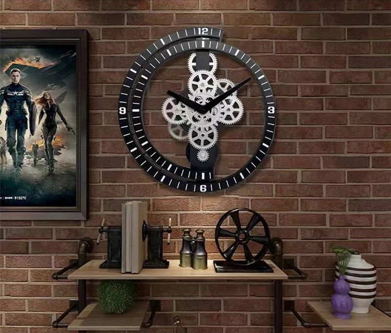 A wall showcasing a modern industrial aesthetic features an Industrial Gear Wall Clock with exposed gears, complemented by a framed poster and a shelf adorned with books and decorative items.