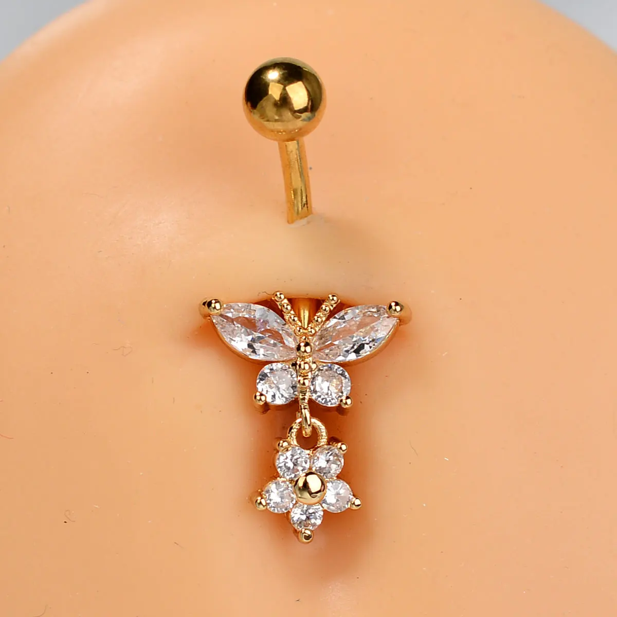 Piercing nombril papillon et fleur