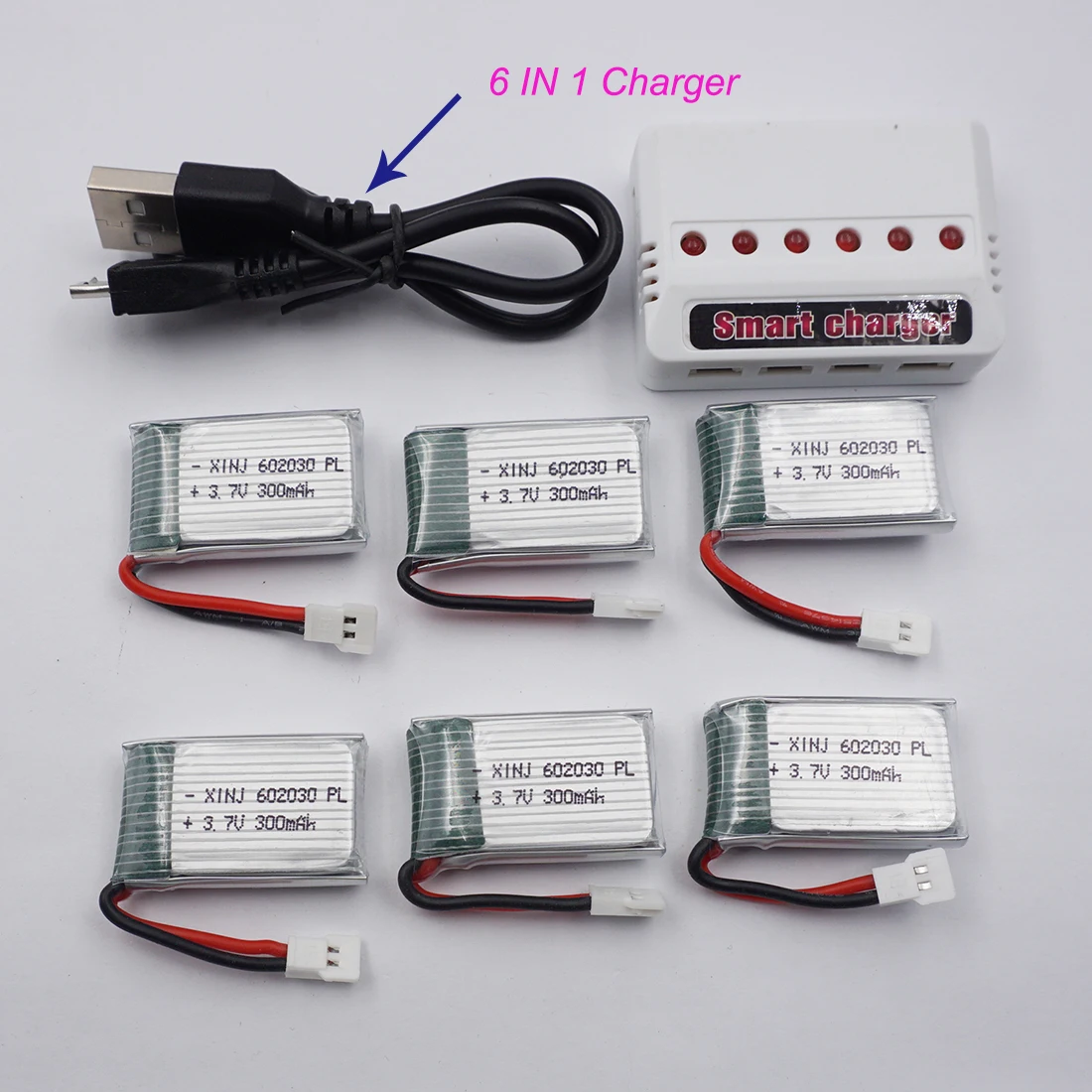 

Charger + 6pcs 3.7V 25C 300 mAh 1.11Wh Rechargeable Polymer Lipo Li Battery 602030 For DFD F182 F183 H8C Syma X5 FY530 RC Drone