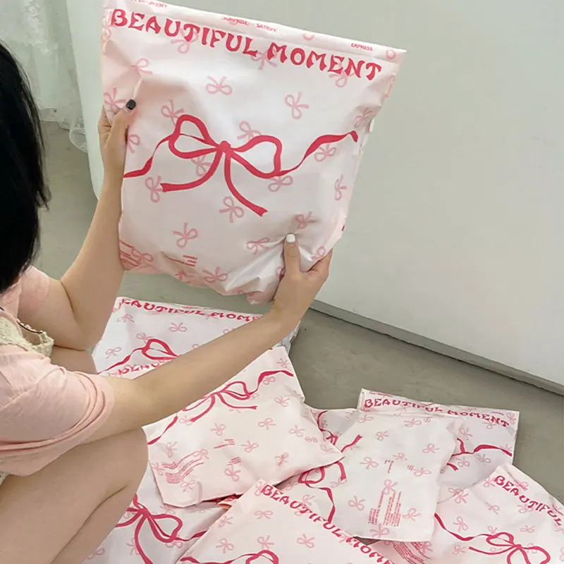 50Pcs Plastic Pink Courier Postal Bag Cute Bow Prinitng Clothes Mailer Storage Packaging Bag Gifts Shoes Express Transport Pouch,courier bag,mailing bags,packing pouches,express bag