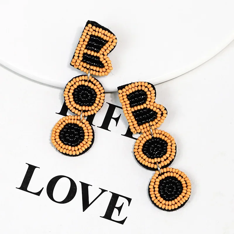 

Beaded earrings Originality The letters boo Hand knitting Bohemia Colour Tide Alloy Design Simple Rice bead earrings