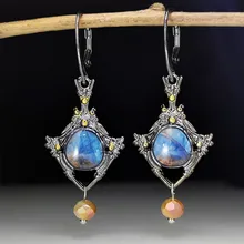 

Exquisite Retro Inlaid Blue Stone Hollowed Out Carved Triangular Earrings and Earrings for Women To Add Charm and Temperament