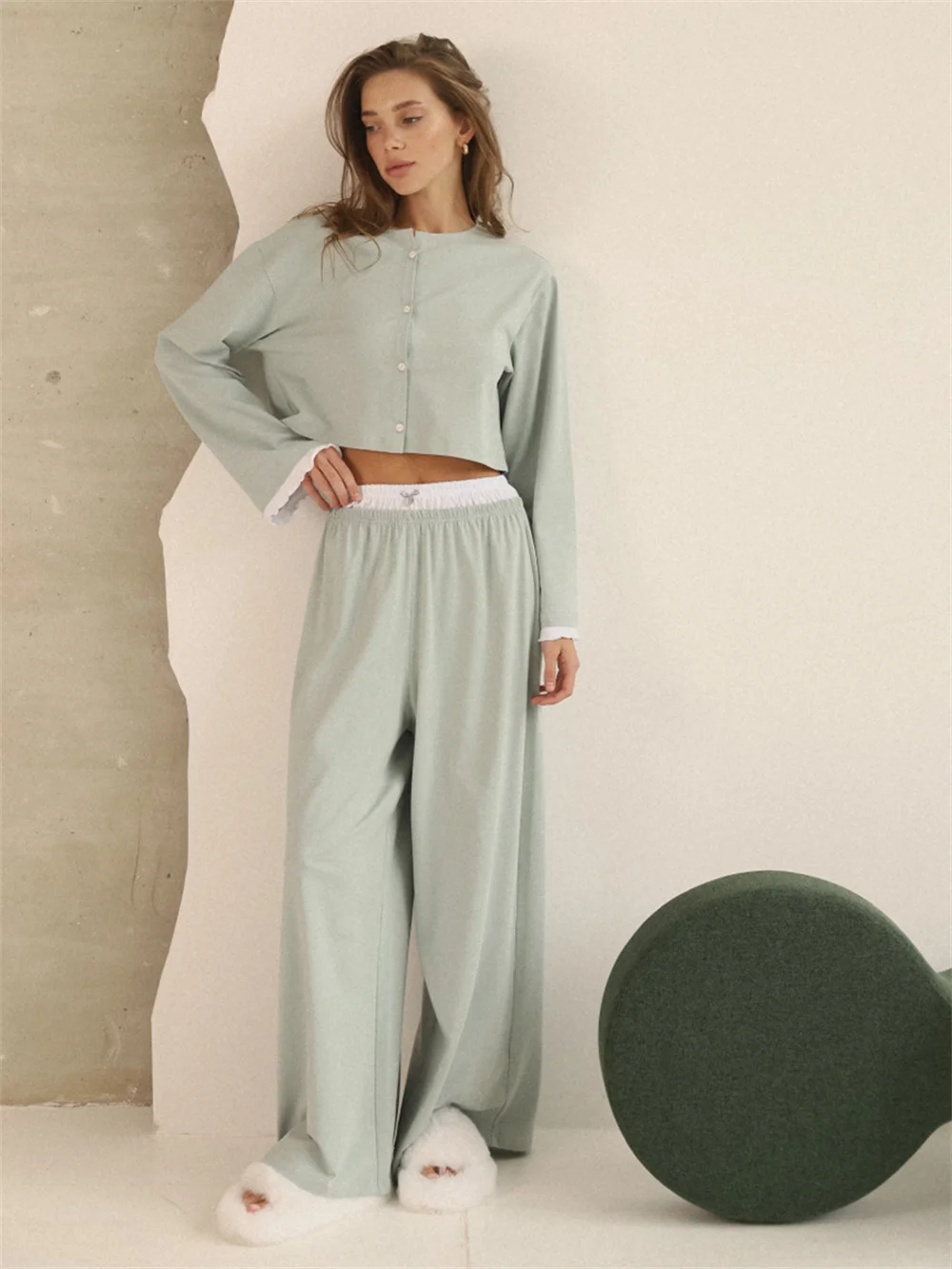 Soft lounge set displayed with relaxed fit, full-length bottoms, and cozy indoor styling