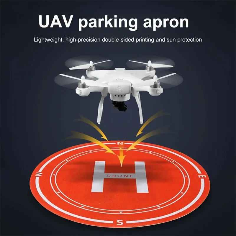 Tapis d'atterrissage pour drone déplié avec marquages de centrage, posé sur sol carrelé, assurant protection et précision.