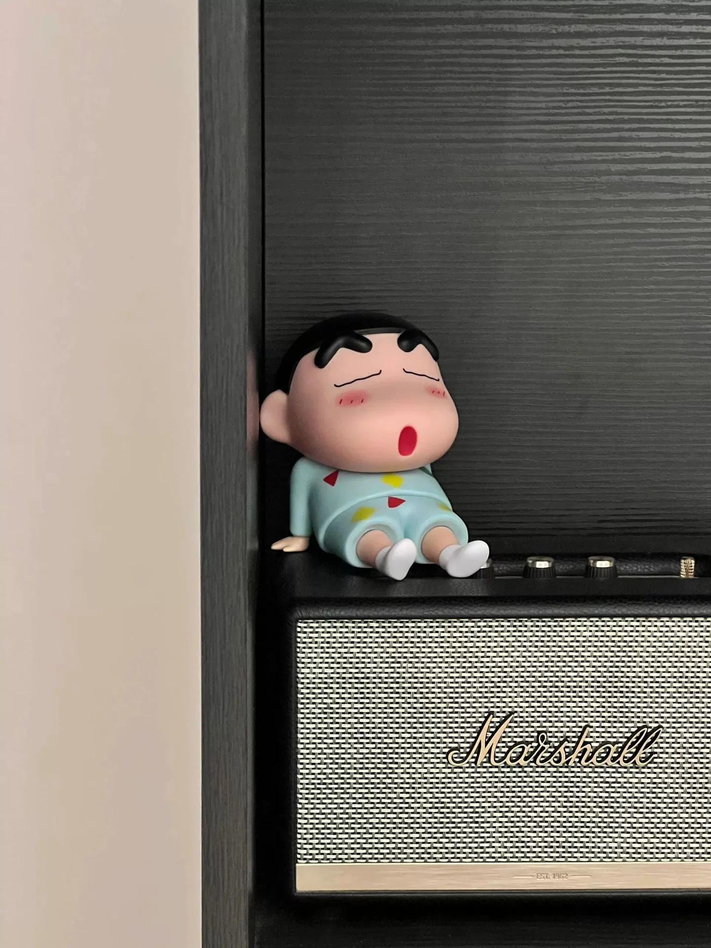 Detailed view of Boochan character on phone holder