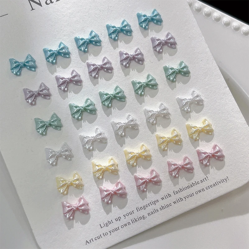 새로운 50PCS 진주빛 3D 네일 아트 보우 참 네일 장식 디자인용 귀여운 매니큐어 액세서리 보우 매듭 DIY 공예 용품