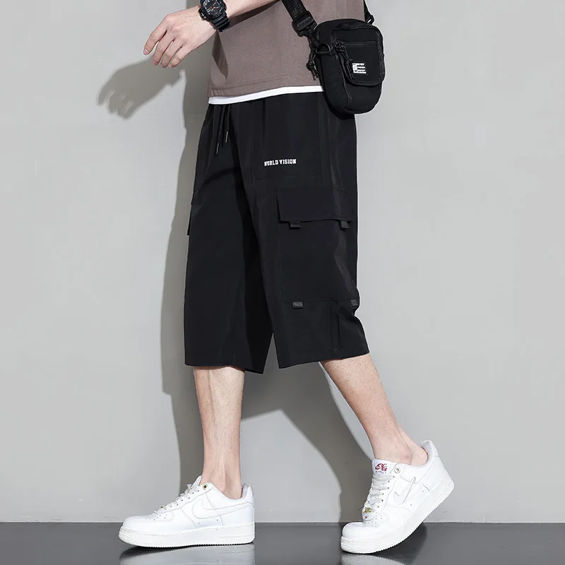 Summer New Solid Color Fashion Elastic Waist Wide Leg Trousers Man High Street Pockets Drawstring Ventilate Calf-Length Pants