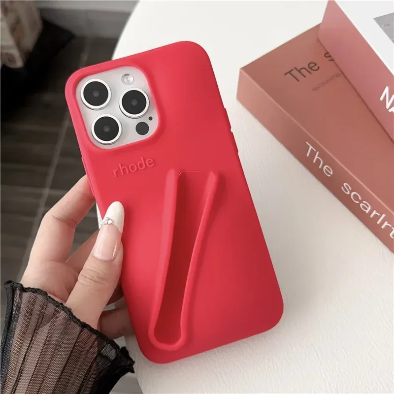 thumbnail image 1 of Estuche para teléfono de silicona suave con diseño de lápiz labial para iPhone 11, 12, 13, 14, 15 Pro Max, soporte portátil para brillo de labios Rhode Hailey, 1 of 5