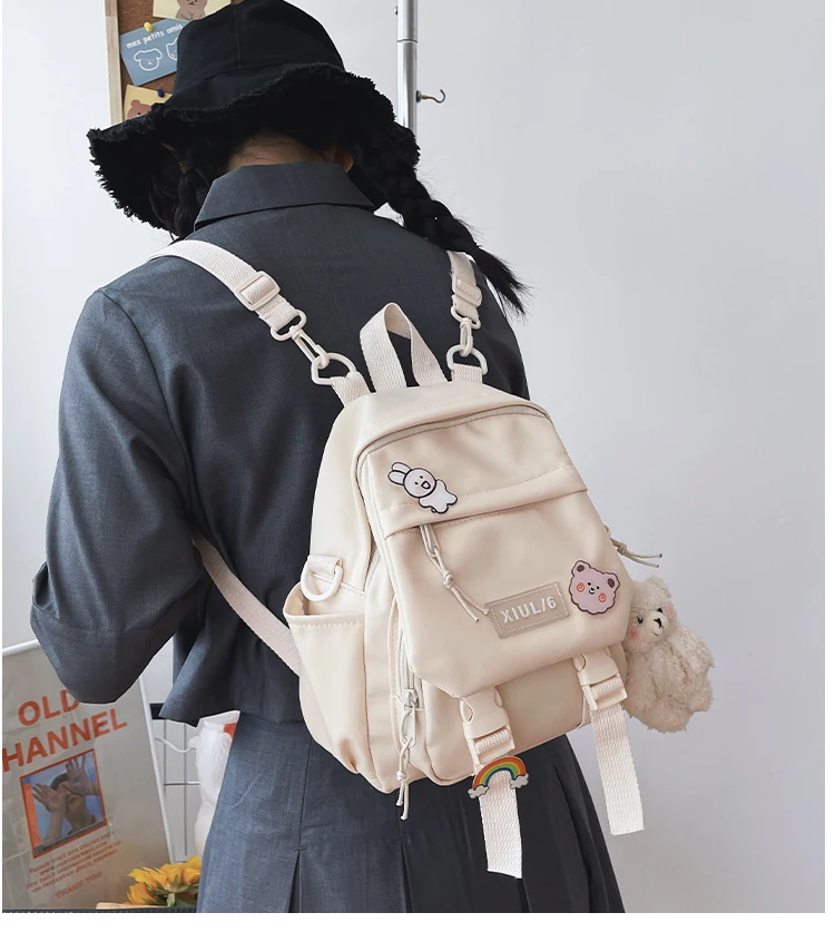 Small pastel backpack for women and girls with dual-use straps, kawaii design, and roomy compartments for school, travel, and casual wear. 05