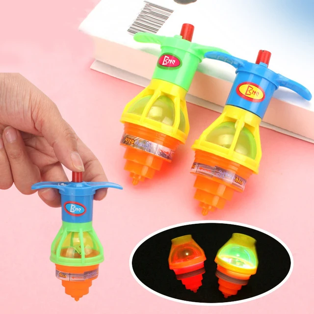 Hot 1Pcs Spinning Top Flash Luminous Spinning Tops Toy Colorful Top Ejection Toy Flashing Led Gyroscope Children Classic Toys 1